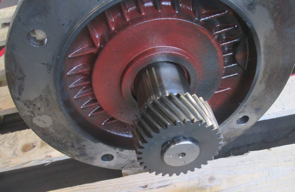 Showing a helical gear attached to the end of the shaft